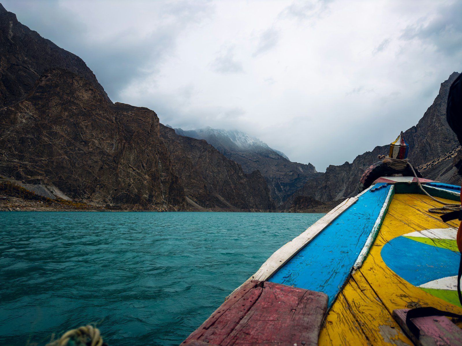 Traveller boating on a mountain lake